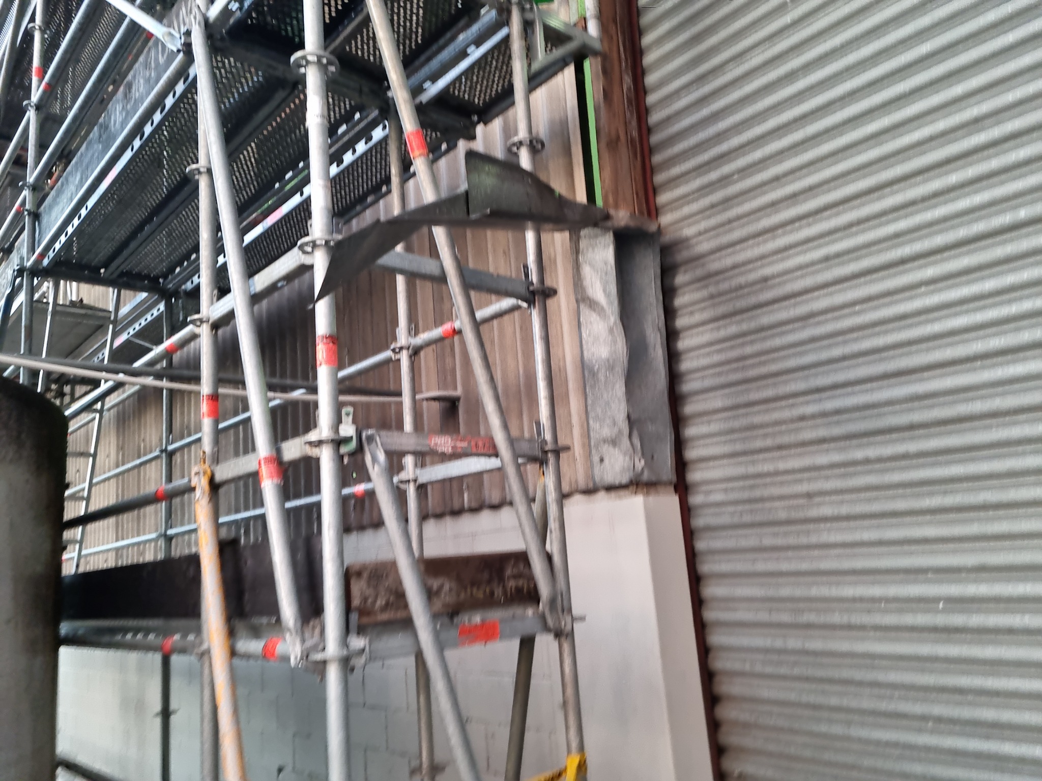 Internal scaffolding installed beside the Wiri warehouse wall